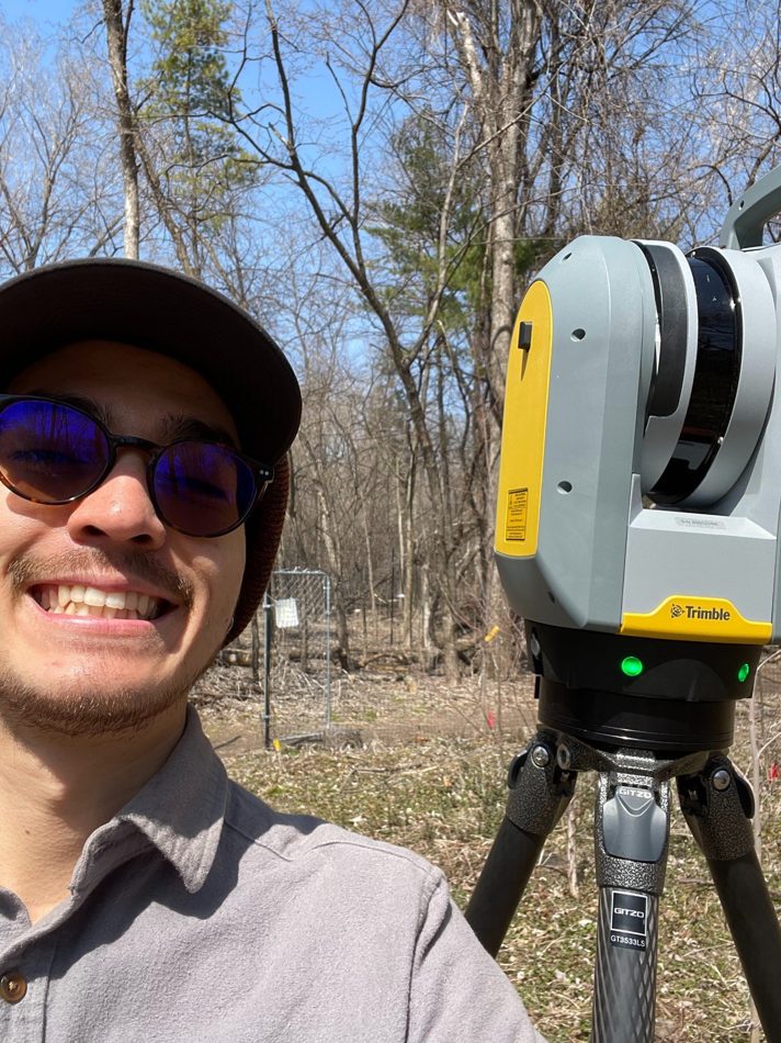 Quentin Ikuta in the field with remote sensing technology